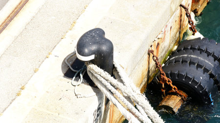Detail of tie of a ship with tires antishock of a wharf