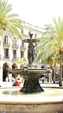Source with sculpture of the Plaza Real of Barcelonaのeditorial素材
