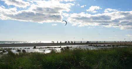 Panoramic of Castelldefels s beach, Barcelona, with comet of kitesurf in the skyの写真素材