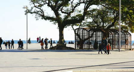 People stroll for the Barceloneta