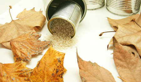 Rice going out of a tin of aluminiumの写真素材