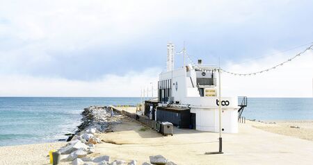 Building restaurant in a malecón in the beach of the Mar Bella, Barcelonaのeditorial素材