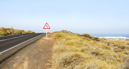 Lonely road in the landscape of Lanzarote, Canary Islandsの写真素材