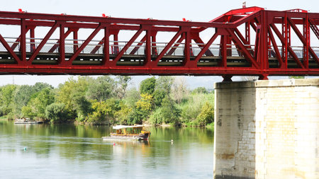 Red iron bridge over the river Ebro in Tortosa, Tarragonaのeditorial素材