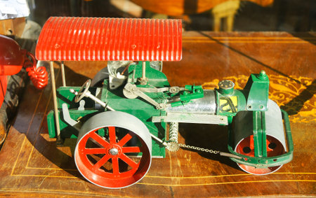 Replica of a toy road roller in a showcaseの写真素材