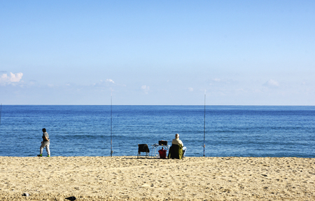 People fishing on the beach in Badalona Barcelonaのeditorial素材