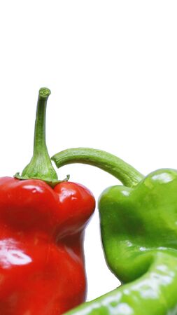 Red and green peppers on white backgroundの写真素材