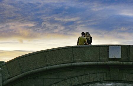 in love on a bridge of the Neva in St. Petersburg, Russiaの写真素材