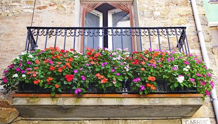 Balcony with flowers in Castellar de N'hug in Girona, Catalonia, Spain, Europeの写真素材