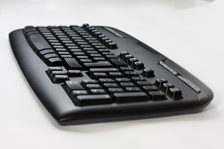 Close-up of a black wireless computer keyboardの写真素材