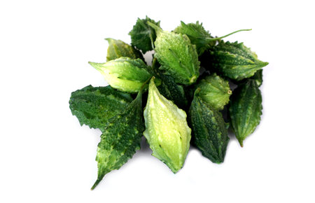 Pile of organic bitter gourd  fruits on white background. Concept, Thai medicinal herbal plants....