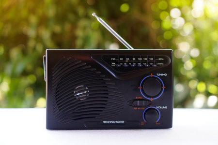 Vintage old transistor radio, placed outdoor. Concept , Analog technology for communication, entertainment, news, songs, music and advertismentの写真素材