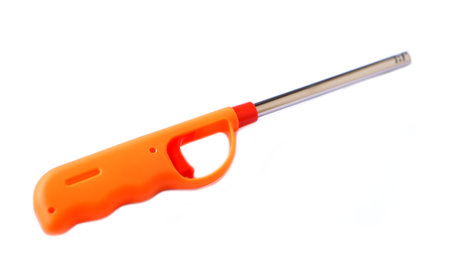 Gas lighter gun isolated on white background. Concept, equipment in kitchen for lid fire on gas stove. Spark igniter appliance. Easy and convenient to use.の写真素材
