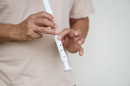 Hands of a musician playing the flute. Musical instrument. Concept, love music. Melody therapy, make concentration. Man practice to play music for being professional flutistの写真素材
