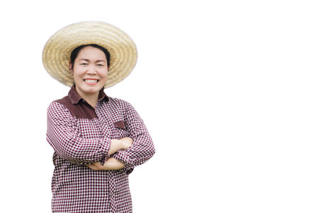 Happy Asian woman farmer wears hat, plaid shirt, crossed arms on chest, smile, feels confident , isolated on white background.Concept. agriculture occupation.の写真素材