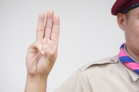 Hand sign code of scout. Concept, Scout activity that teaching in schools Thailand. Hand signs and symbols which meaningful in scouting lesson. Show hand sign for oath.の写真素材