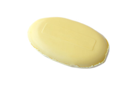 Yellow soap isolated on white background. Concept, 
Soap for cleaning body skin, hygiene, eliminating body odor, sweat, dirt and bacteria. Taking a bath with soap.の写真素材