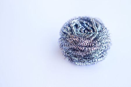 Stainless steel wool scrubbers for scrubbing pots, isolated on white background. Concept, kitchen cleaning tool. Utensil. Household.の写真素材