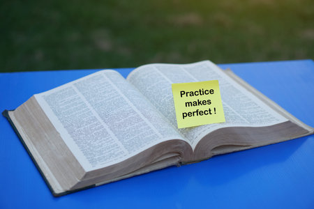 A yellow sticky note on an open book