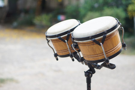 Bongo drums, outdoor background. Concept, musical instrument for rhythm of music to make more fun for performing or dancing. Beat drum with rhythm along music and songs.の写真素材