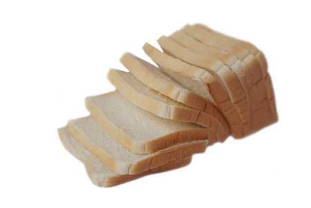 Loaf of homemade slide soft bread isolated on white background. Concept, food for breakfast.