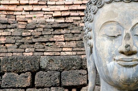 ancient buddha image statue at Sukhothai historical park Sukhothai province Thailandの写真素材