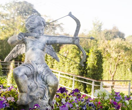 Statue of Cupid angel  in Thailandの写真素材
