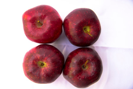 Apple in a row of white scenes