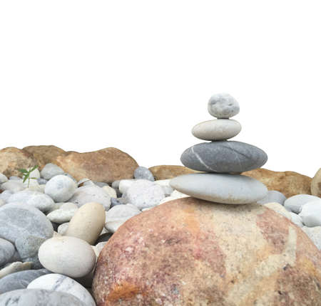 Round stone stacked together white backgroundの写真素材