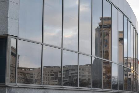 Multicolor city sunset in the mirroring. Glass skyscraper, modern building.の写真素材