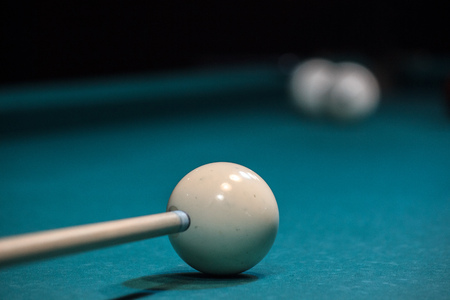 the cue is aimed at white ball, accurate blow to the ball. to score in a pocket, to win.の写真素材