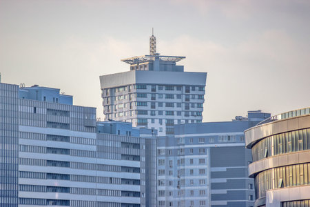 modern multi-storey building, skyscraper. construction of glass house. a large number of residential...