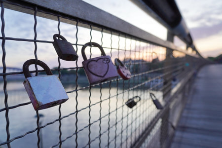 modern bridge in sunset light, colored sky and clouds, city sunset by the river, water. evening...