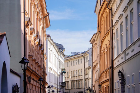 narrow cozy street of old town on a Sunny day. beautiful low-rise houses on the curve of the road.