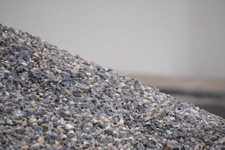 Small gray rubble or gravel, road surface. Background from pile of small stones.の写真素材