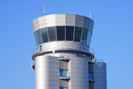 Control tower of the international airport. Aviation control room. Modern airport building, gray...
