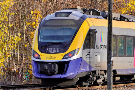 Poland, Krakow: 13.11.2019 - eco-friendly tram in city, tourist route in Park, walk through autumn...