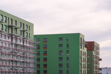 Poland, Krakow 02.16.2020: Modern multi-storey residential building with black facade finish and...