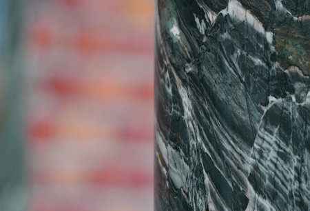 The background of green marble structure with streaks and cracks is close. Natural background