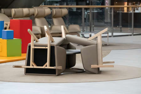 Krakow, Poland 03.31.2020: Empty corridor with chairs and playground in store during a coronavirus pandemic and epidemic.Quarantine, stay at home.No people,armchairs are overturned, not allowed to sitのeditorial素材