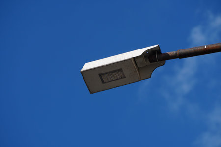 Lighting mast with lantern on a city street during the day. Lighting of roads and streets, stadiums...