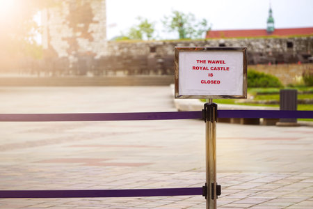 Krakow, Poland 06.05.2020: Fence blocking the passage to Wawel castle in Krakow due to coronavirus....