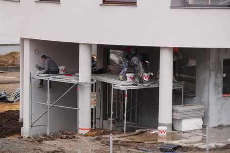 New building under construction and construction site of a residential building. formation of cement...