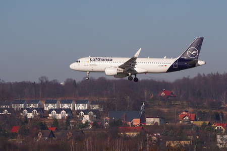 Airplane Lufthansa Airbus A320 on background of blue sky. Cancellation or resumption of flights, pandemic and quarantine 2020. Civil aviation, plane takeoff, clear sky. Krakow, Poland 20.02.2019のeditorial素材