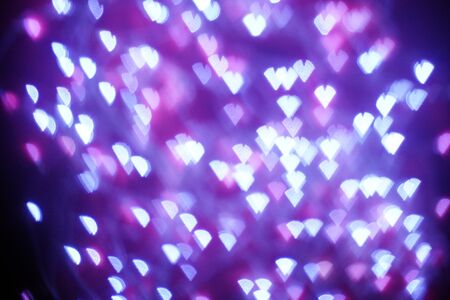 Blue lights on purple background are blurred. Concept of blank frame,copy space. Christmas or new year flatlay background.の写真素材