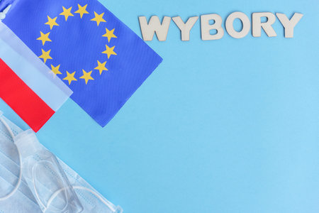 President wybory-translation voting-in Poland on coronavirus pandemia time. Disinfector,mask and...