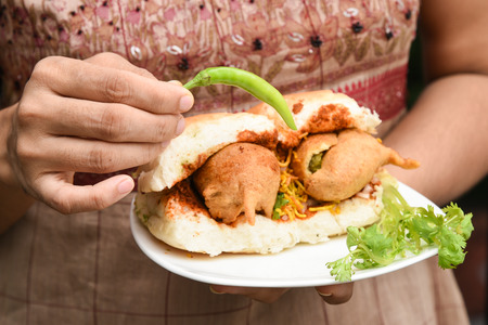 Female holding popular Indian street food snackの写真素材