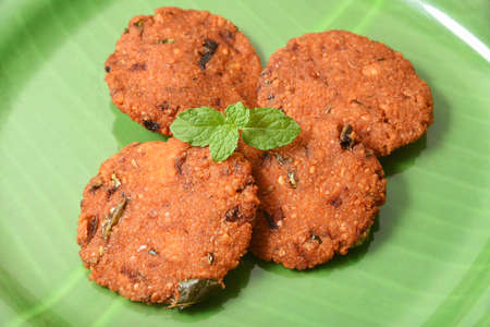 Parippu vada with Indian tea or Chai Kerala Snacks popular deep fried hot and spicy tea time food. Traditional food for Ramadan, Onam, Vishu in tamil nadu, Street food of India.の写真素材