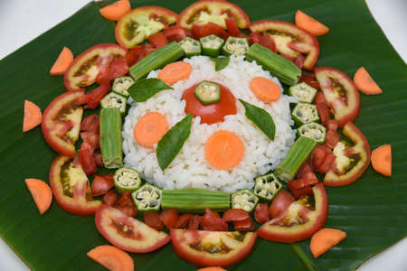 Kerala harvest festival Onam celebration, Kerala South India. Pookalam or flowerbed, Special vegetarian food made with fresh cut vegetables. flower carpet, flower bedの写真素材