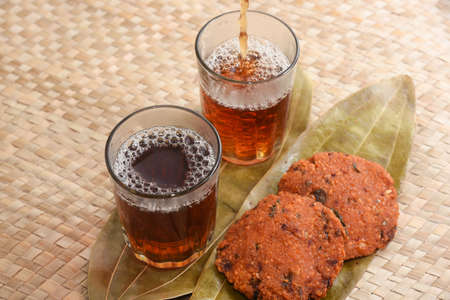 Parippu vada with Indian tea or Chai Kerala Snacks popular deep fried hot and spicy tea time food. Traditional food for Ramadan, Onam, Vishu in tamil nadu, Street food of India.の写真素材